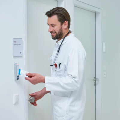 door-access HID keyless entry pad on a wall